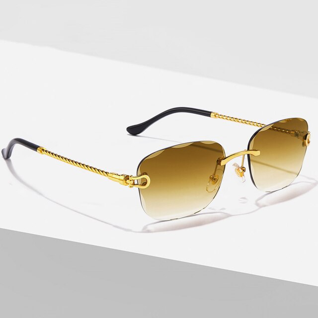 Unisex Zonnebril met Gekleurde Glazen en Goudkleurig Montuur UV400 Bescherming en Luxe Randloos Design