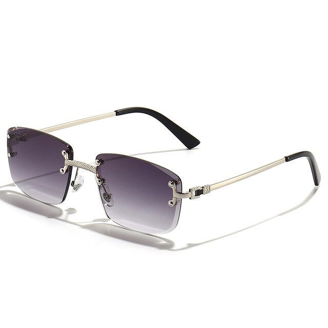 Unisex Zonnebril met Gekleurde Glazen en Goudkleurig Montuur UV400 Bescherming en Luxe Randloos Design