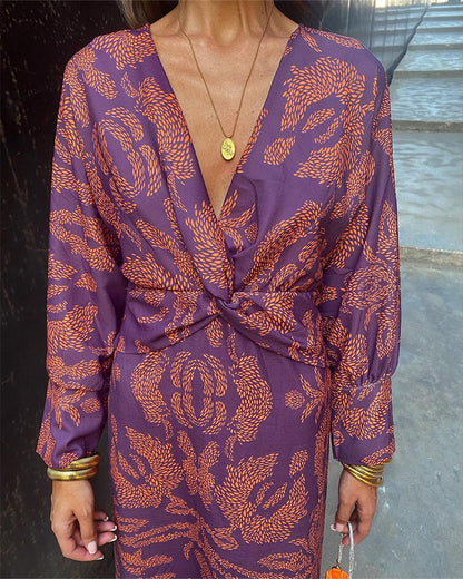 Luxe maxi jurk met diepe V-hals, gouden print en lange mouwen – stijlvolle feestjurk voor dames