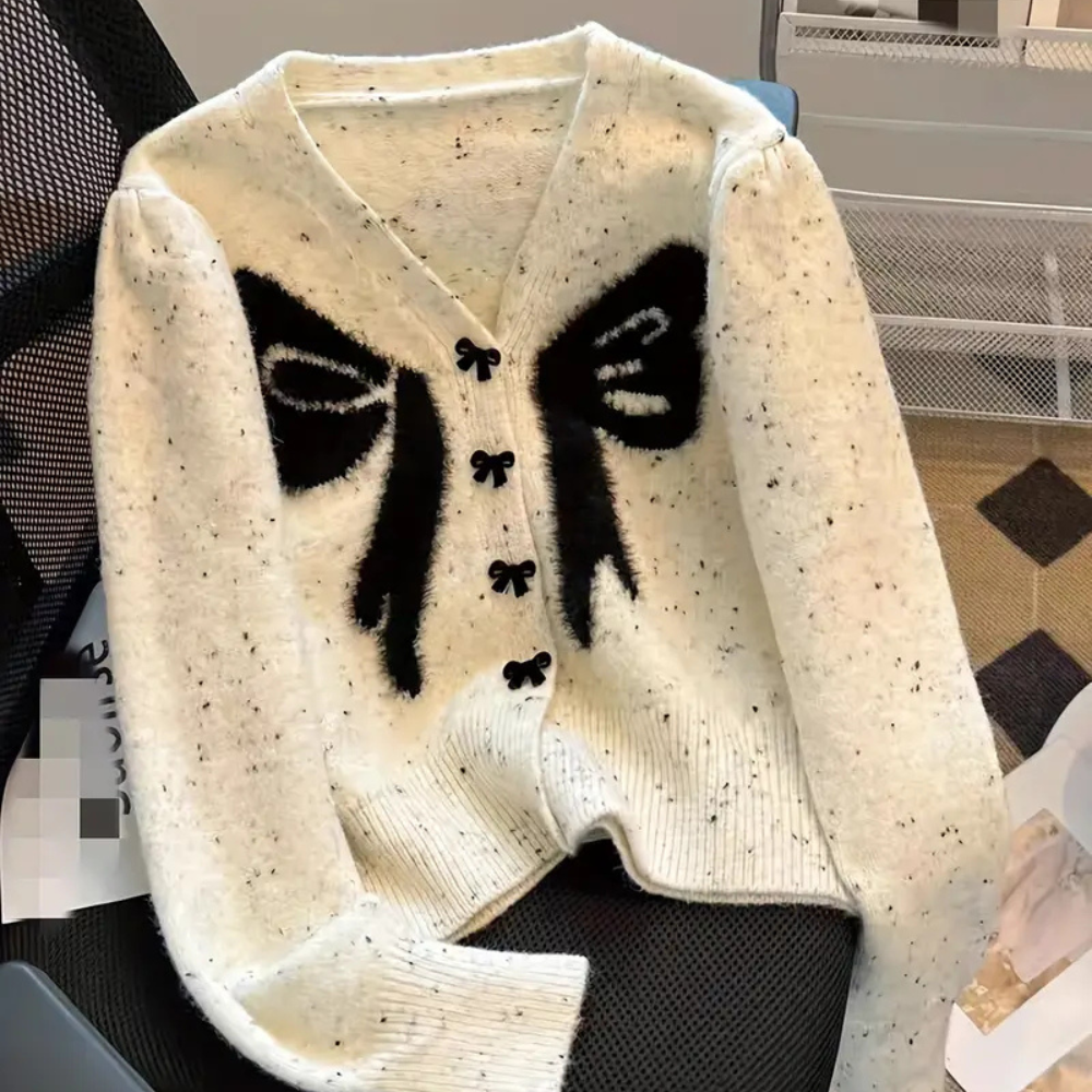 Mirella - Damesvest met speels strikdessin