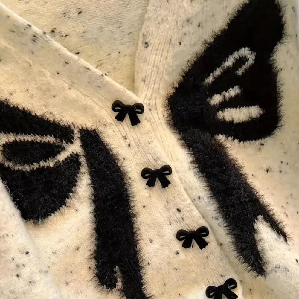 Mirella - Damesvest met speels strikdessin