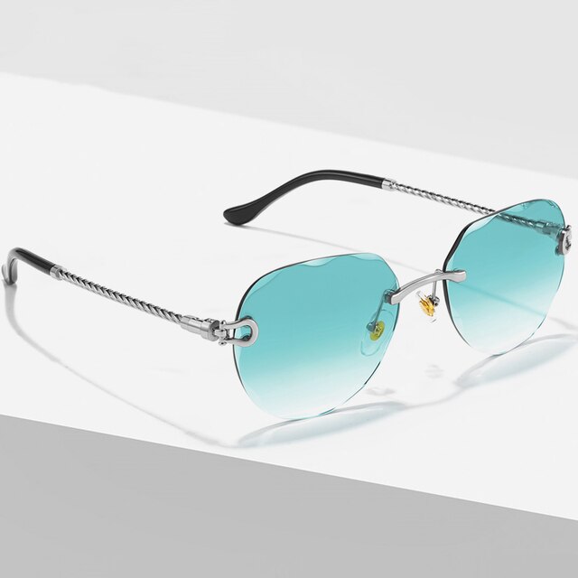 Unisex Zonnebril met Gekleurde Glazen en Goudkleurig Montuur UV400 Bescherming en Luxe Randloos Design