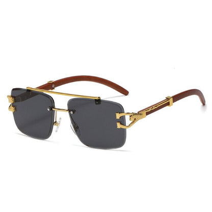 Unisex Zonnebril met Gekleurde Glazen en Goudkleurig Montuur UV400 Bescherming en Luxe Randloos Design