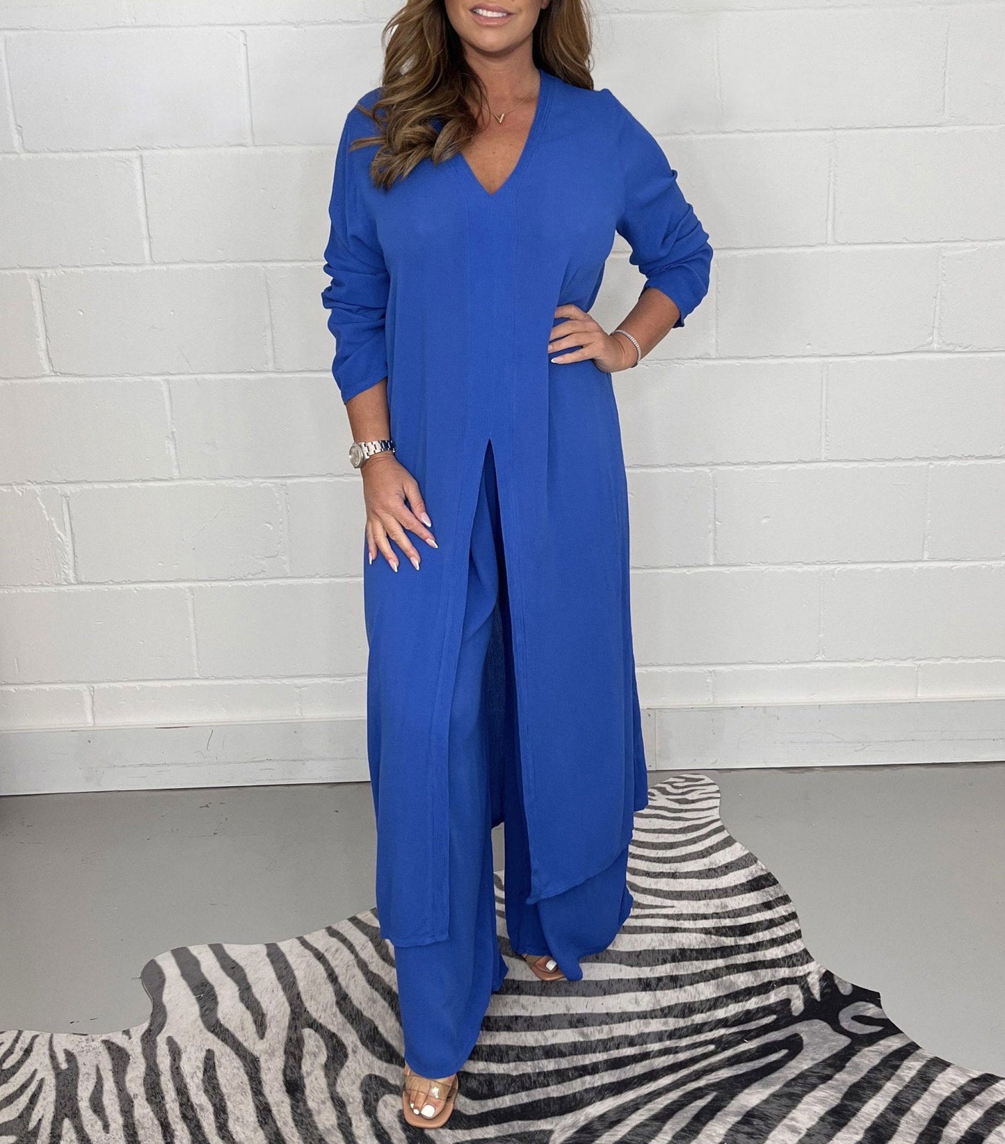 Dames tweedelig pak met elegante lange top en wijde broek in diverse kleuren