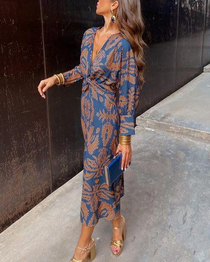 Luxe maxi jurk met diepe V-hals, gouden print en lange mouwen – stijlvolle feestjurk voor dames
